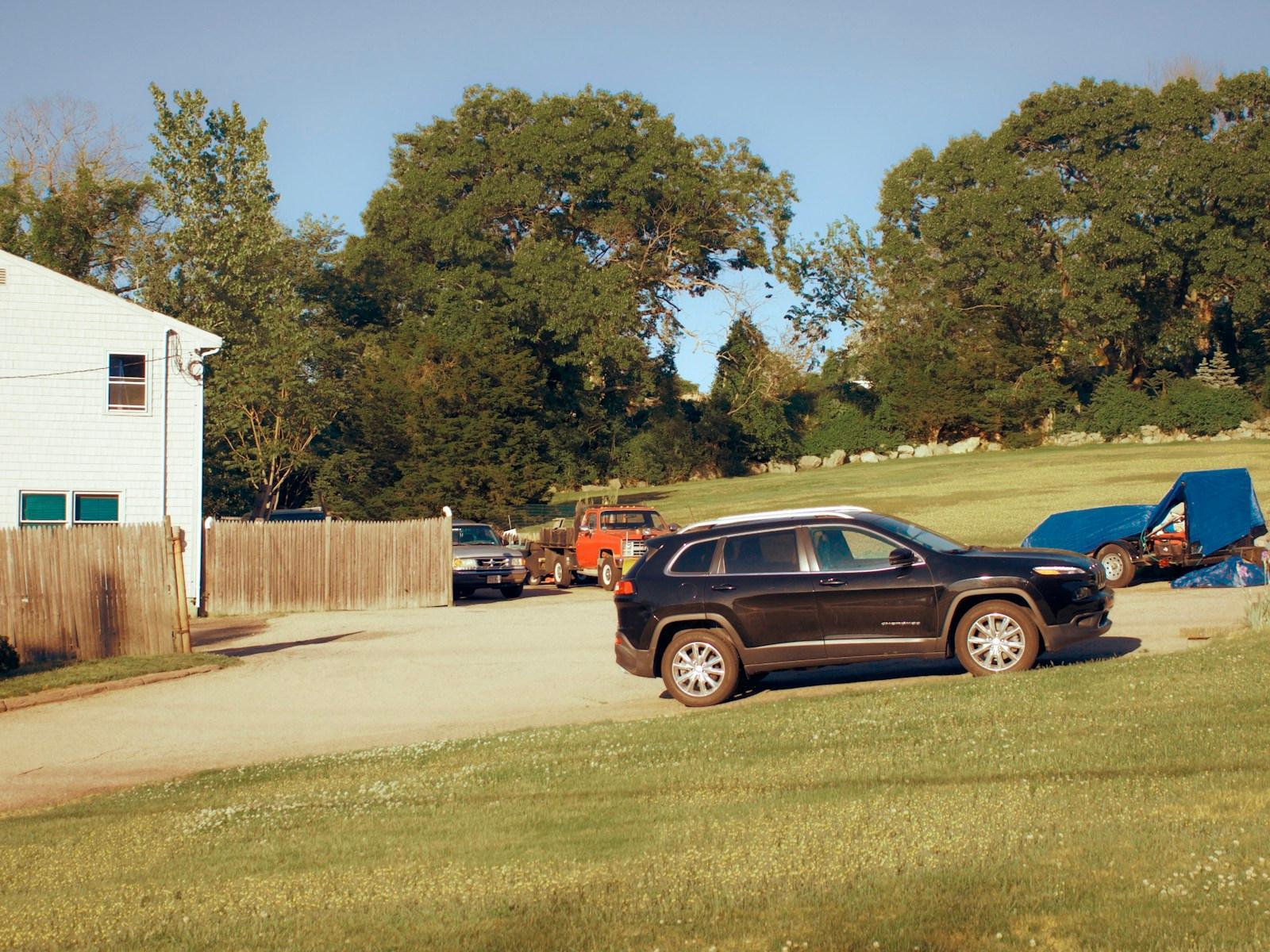 Black mid-size SUV parked on a residential property